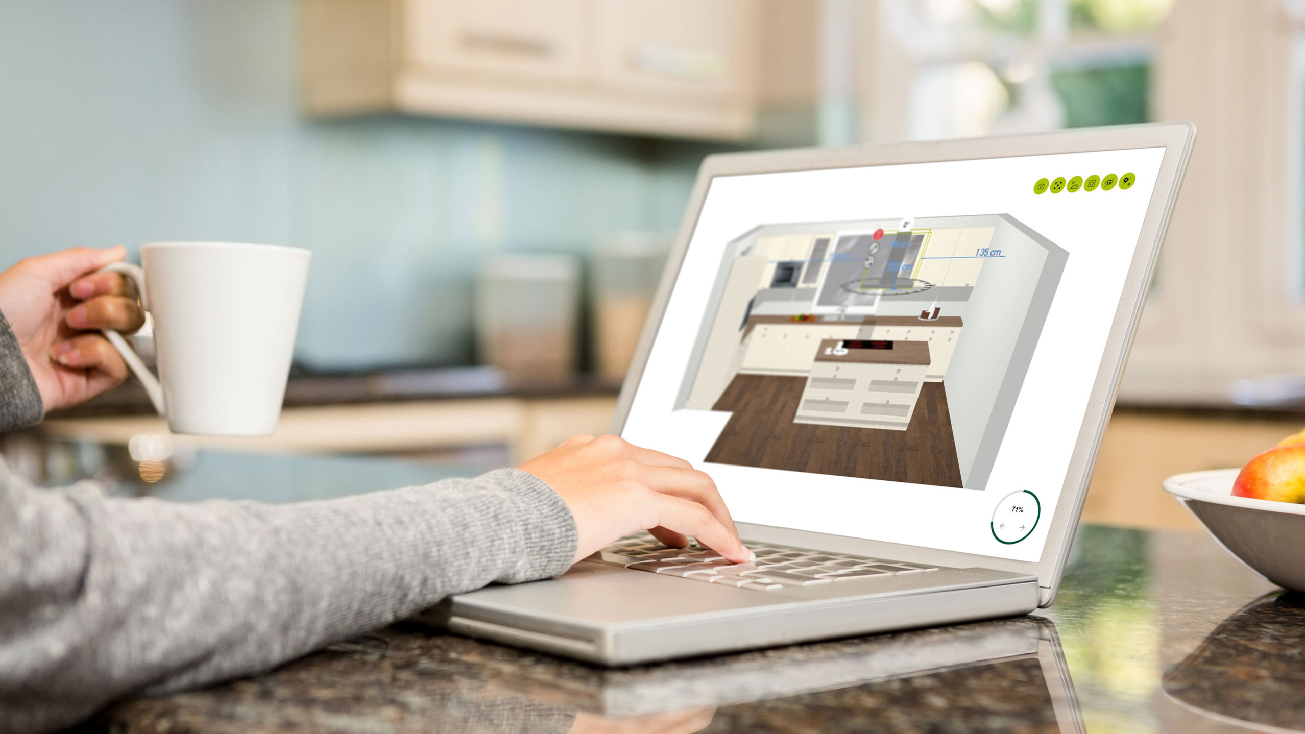 image of person using laptop to view 3d model of kitchen layout.