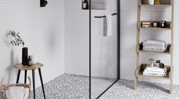 image of glass shower screen with mosaic flooring in bathroom